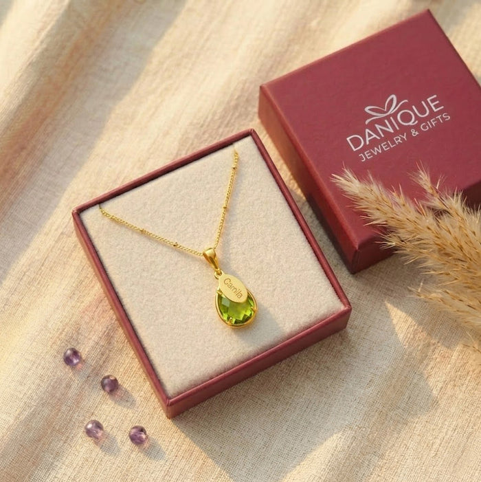 Personalized peridot birthstone necklace in Danique Jewelry gift box, a meaningful custom name necklace for birthdays, Mother’s Day, or Christmas.