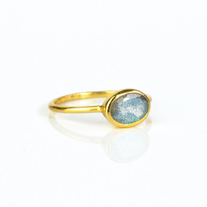 a gold labradorite ring shown on white background. stackable! Stacking rings, bezel set, small oval, tiny oval, dainty oval, birthstone rings, sterling silver stamp, birthstone ring, birthstone jewelry, iridescent gemstone, gray birthstone
