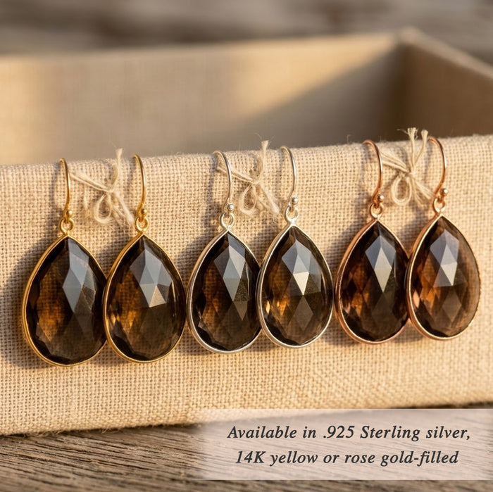 Smoky quartz earrings set in gold with teardrop shape and rich brown crystal