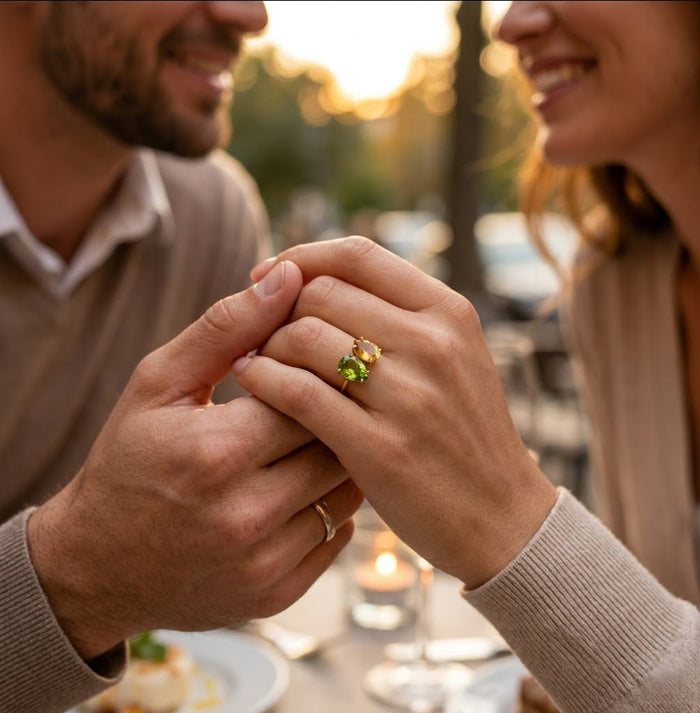 Gold two birthstone ring worn by a woman as a personalized everyday jewelry gift