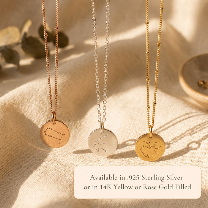 Zodiac disc necklaces available in silver, yellow gold, and rose gold with constellation designs.